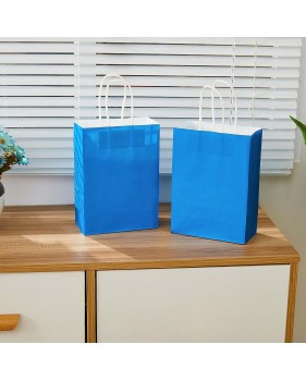 Blauwe Draagtassen van gekleurd kraftpapier met gevlochten oren 18x...