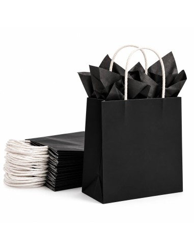 sac en papier kraft noir garni de papier de soie noir, devant un paquet de sacs pliés