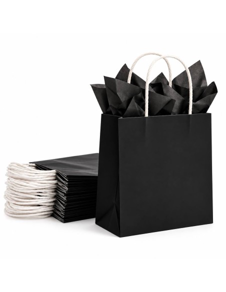 sac en papier kraft noir garni de papier de soie noir, devant un paquet de sacs pliés