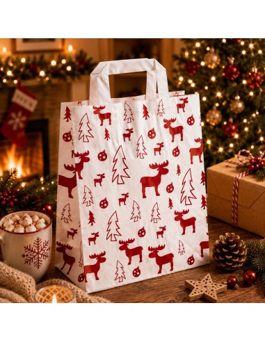 Witte papieren kerstcadeauzak met elandmotief in kerstsfeer